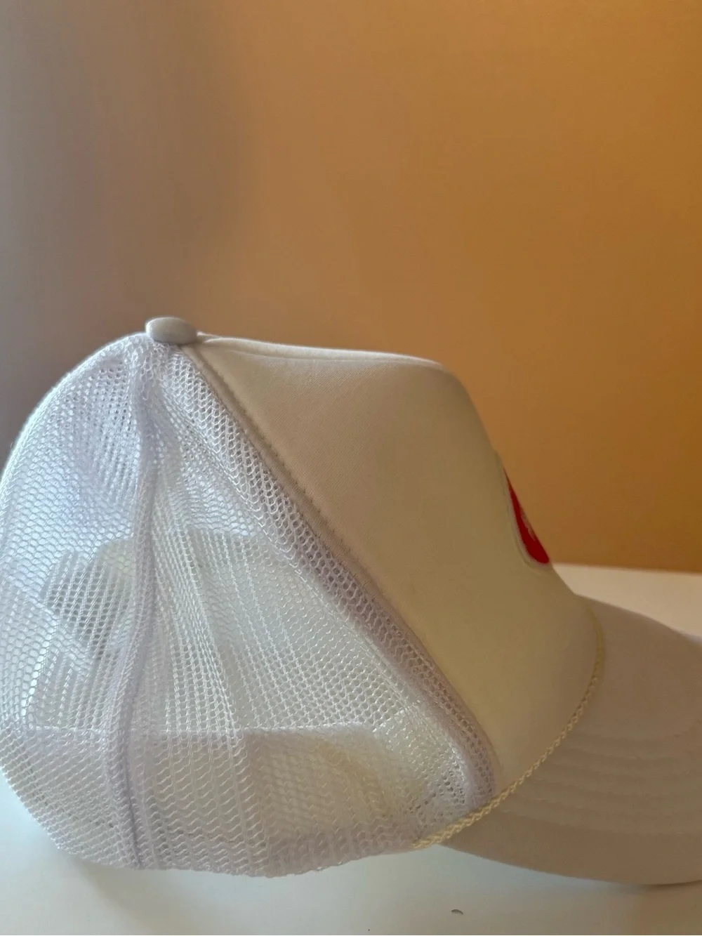 Trucker hat with crimson football